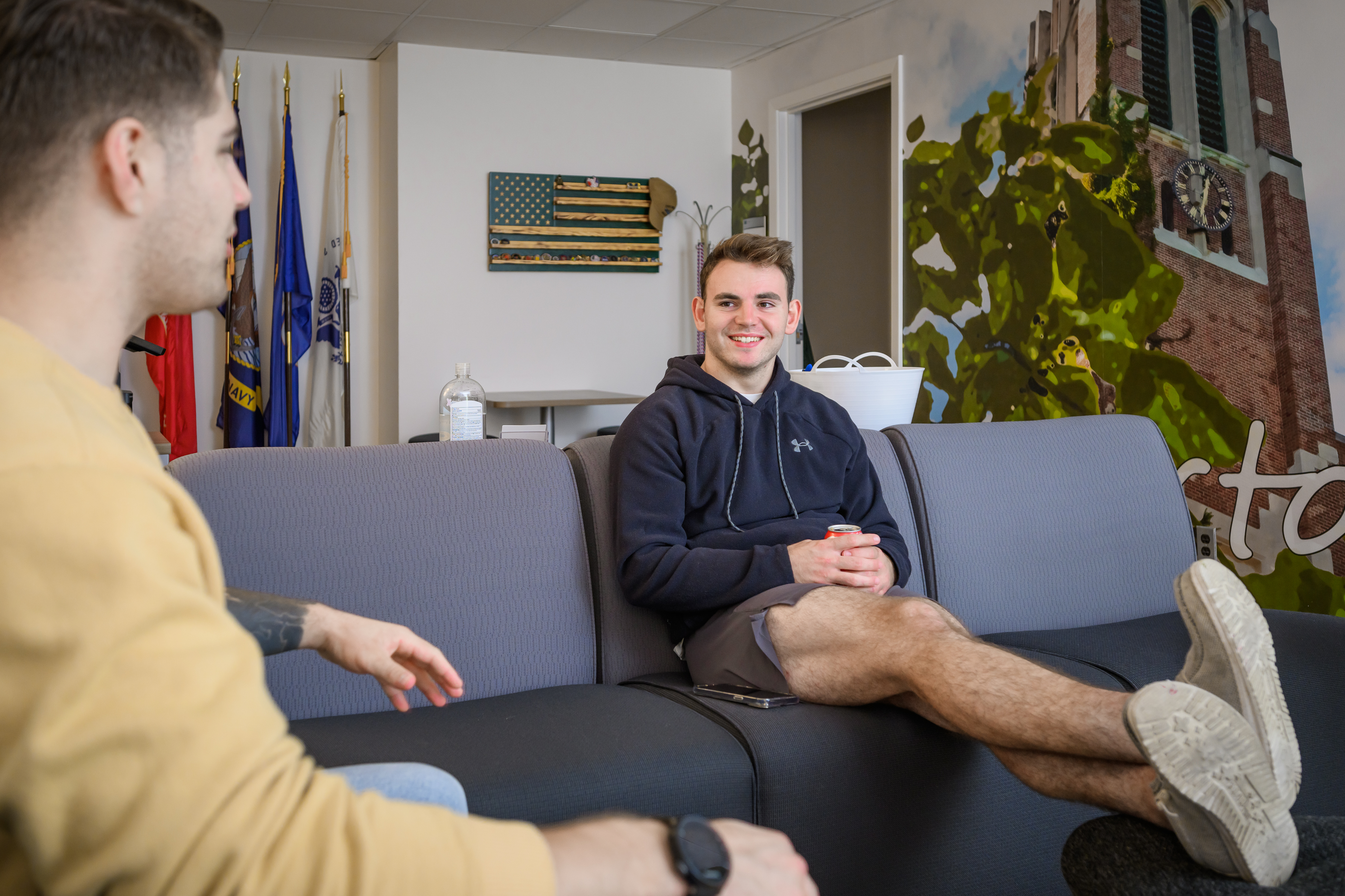 Two students sitting in the lounge talking